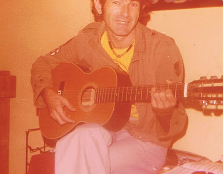 John Perth playing guitat 1977